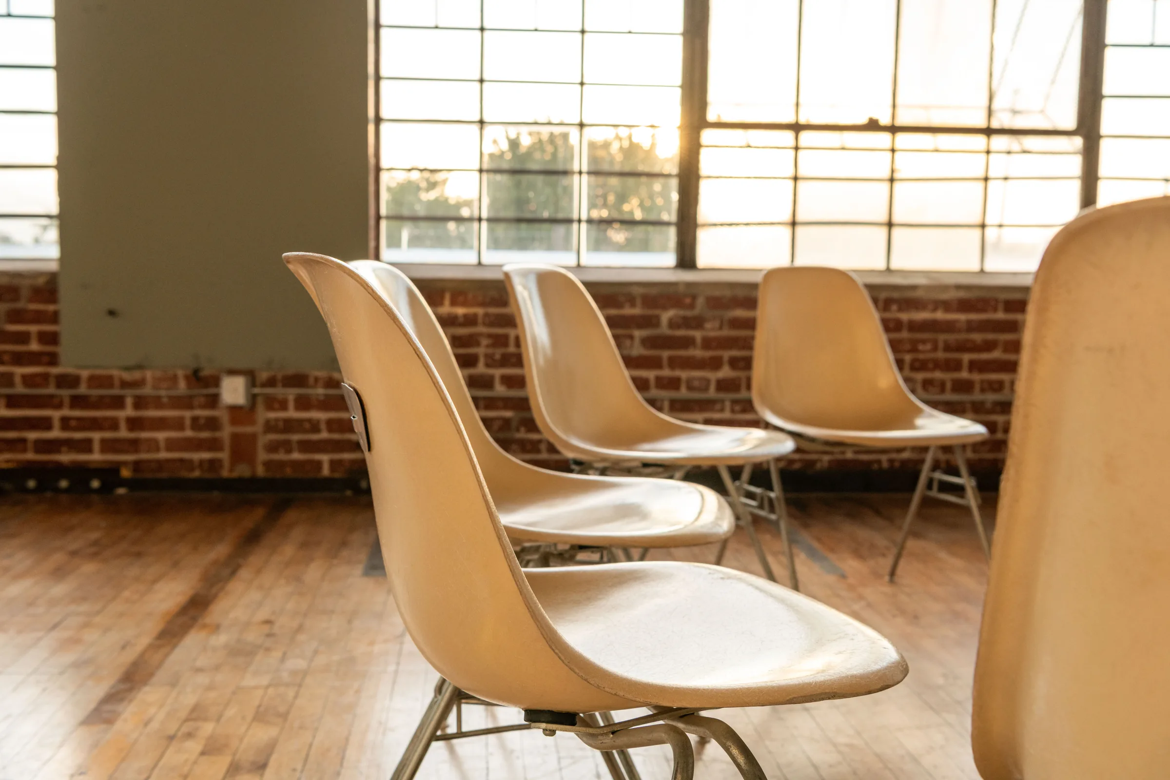 Empty chairs in a sunlit room