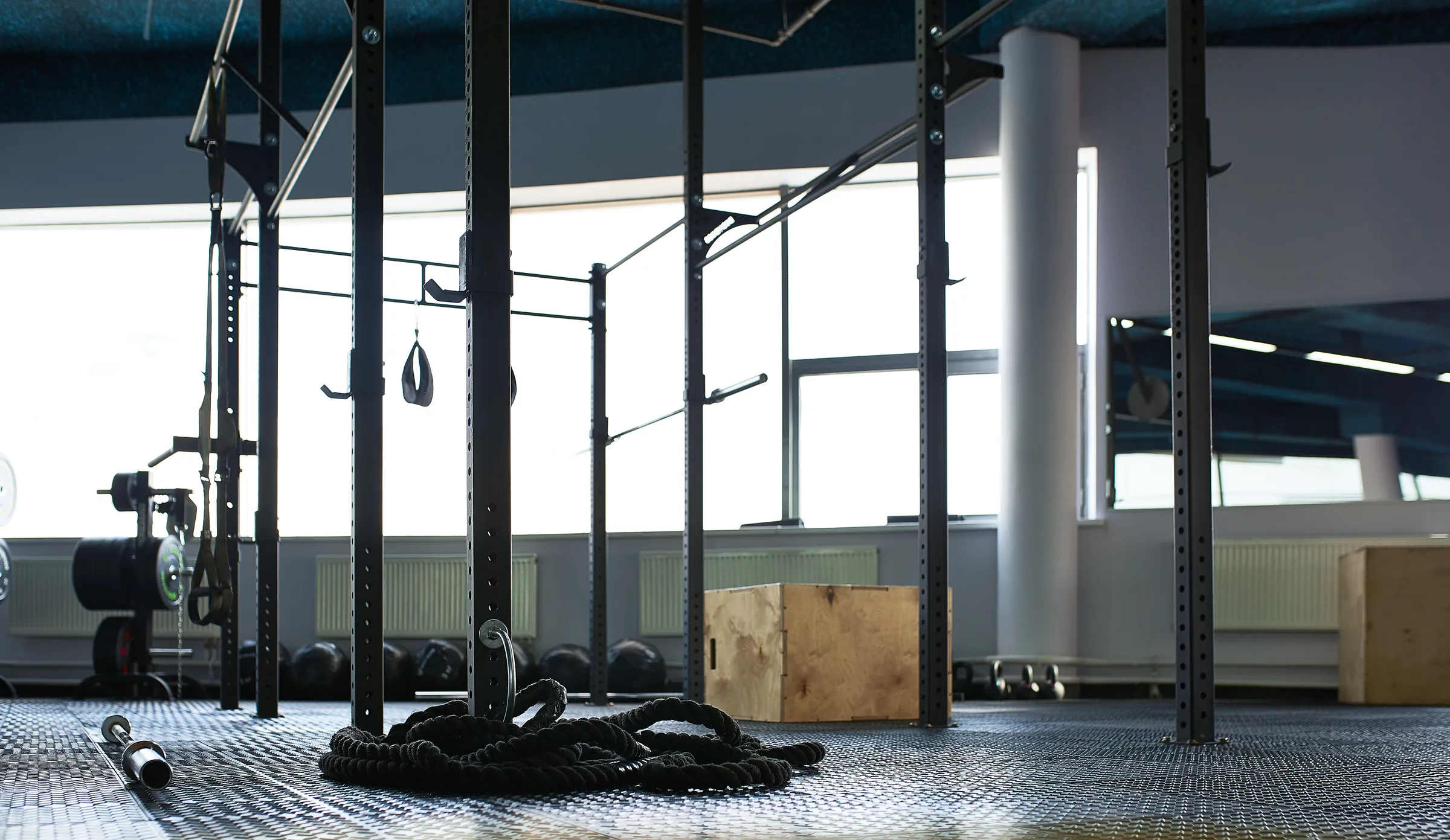 An empty gym floor with the ropes left where they fell